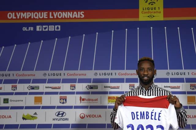 Moussa Dembele poses with his new jersey at the Groupama Stadium on September 1. Picture: AFP/Getty Images