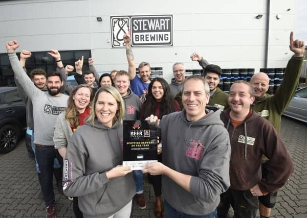 Pic - Greg Macvean - Stewart Brewing celebrate winning best brewery award at their brewery in Loanhead. Jo Stewart is pictured centre left with award.