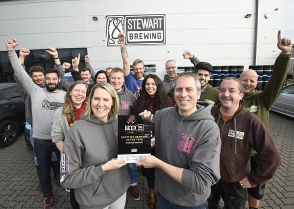 Pic - Greg Macvean - Stewart Brewing celebrate winning best brewery award at their brewery in Loanhead.  Jo Stewart is pictured centre left with award.