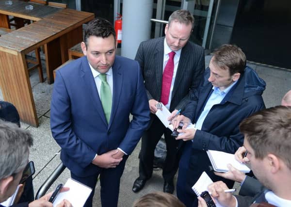 Miles Briggs speaks to reporters at a press conference. Picture: Jon Savage
