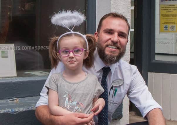 Lerwick store director and optometrist Thomas Bruin with little Etta. Picture: Specsavers/PA Wire