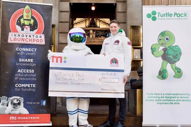 The winner of the Autumn 2018 Innovator Launchpad Michael Harkins is presented with his cheque. Picture: TSPL
