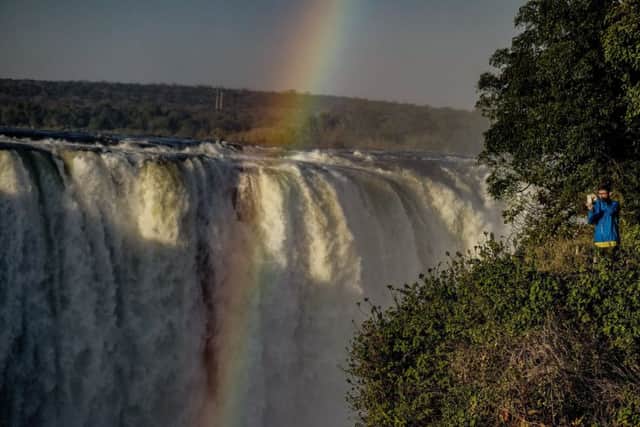 A rainbow over Victoria Falls, where tourists are beginning to return. Picture ZINYANGE AUNTONY/AFP/Getty Images