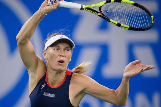 Caroline Wozniacki of Denmark hits a return against Rebecca Peterson of Sweden. Picture: Nicolas Asfouri/Getty Images