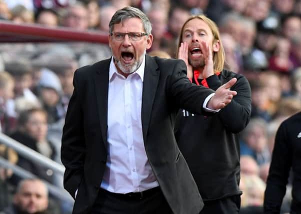 Hearts manager Craig Levein and assistant Austin MacPhee shout out instructions to their players during Saturday's goalless draw with Livingston. Picture: SNS