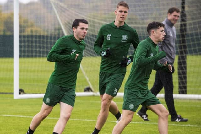 Fit-again Kristoffer Ajer, centre, trains yesterday with Lewis Morgan and Mikey Johnston. Picture: Sns.