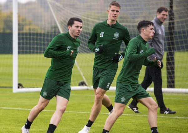 Fit-again Kristoffer Ajer, centre, trains yesterday with Lewis Morgan and Mikey Johnston. Picture: Sns.
