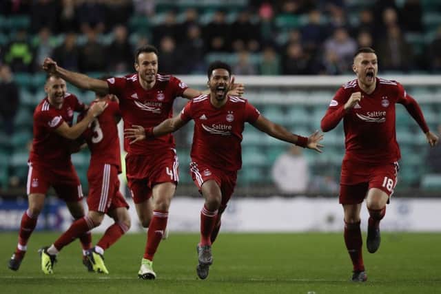 Aberdeen players react to their penalty shootout win over Hibernian. Picture: Ian MacNicol/Getty Images