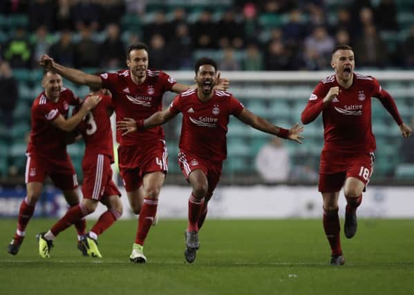 Aberdeen players react to their penalty shootout win over Hibernian. Picture: Ian MacNicol/Getty Images