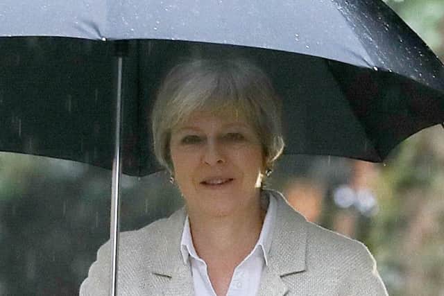 Theresa May doesnt need to worry about saving for a rainy day, unlike the three million women denied their pension. Picture: PA