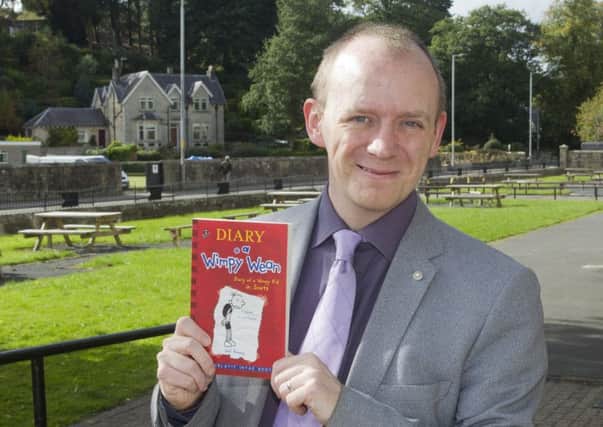 Winning formula...author and school librarian Thomas Clark hopes pupils at Hawick High, and across the Borders, will enjoy his version of the Wimpy Kid book. (Pic: Bill McBurnie)