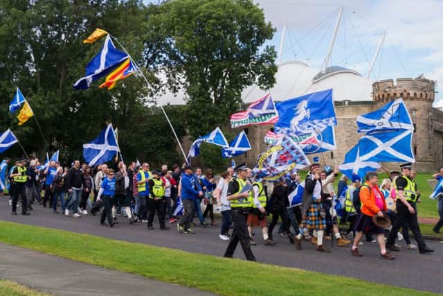 Indy supporters march on the Scottish Parliament on the anniversary of the independence referendum. Picture: Steven Scott Taylor / J P License