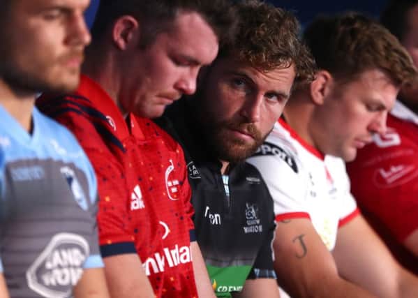 Callum Gibbins sneeks a peak at the opposition during the Celtic launch of the Heineken Champions Cup in Dublin.