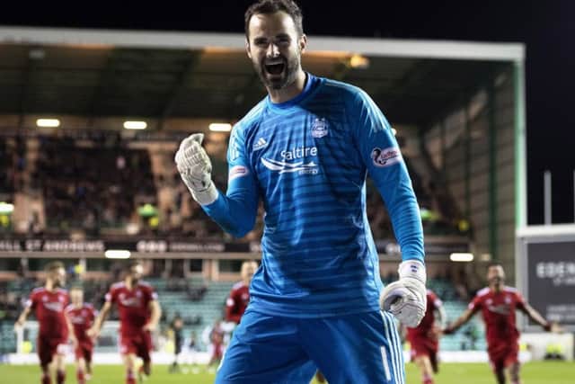 Aberdeen's Joe Lewis celebrates after the penalty shootout against Hibs. Picture: Craig Williamson/SNS