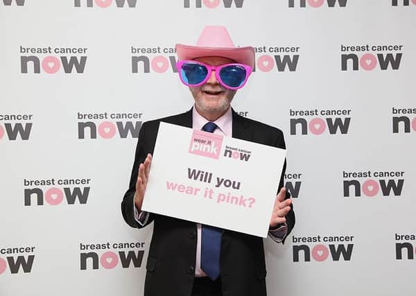 Argyll and Bute MSP Michael Russell takes part in wear it pink event at Scottish Parliament for Breast Cancer Now. Photo by Abbie McCann