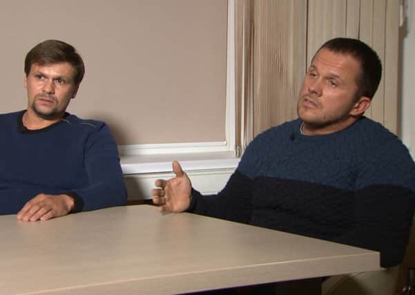 In this video grab provided by the RT channel on Thursday, Sept. 13, 2018, Ruslan Boshirov, left, and Alexander Petrov attend their first public appearance in an interview with the RT channel in Moscow. Picture; AP