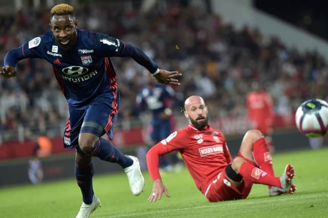 Moussa Dembele leaves Laurent Ciman grounded as he gets on the ball. Picture: AFP/Getty Images