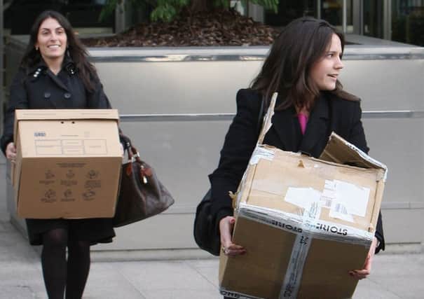 Two employees leave Lehman Brothers' Canary Wharf office carrying belongings on 15 September, 2008. Picture: Cate Gillon/Getty