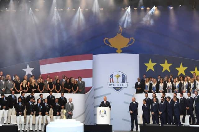Host David Ginola with the European team, right, and their USA rivals, left, at the Ryder Cup opening ceremony at Le Golf National in Paris. Picture: Franck Fife/AFP/Getty