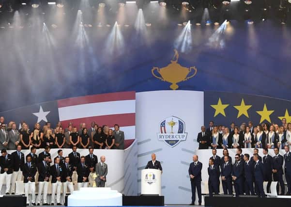 Host David Ginola with the European team, right, and their USA rivals, left, at the Ryder Cup opening ceremony at Le Golf National in Paris. Picture: Franck Fife/AFP/Getty