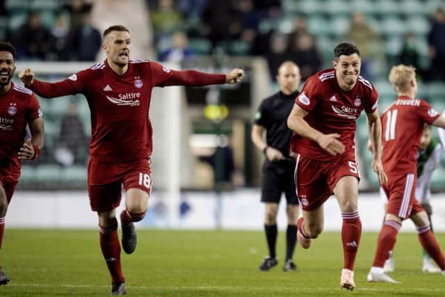 Aberdeen players celebrate their Betfred Cup quarter-final penalty shootout win over Hibs. Picture: Craig Williamson/SNS