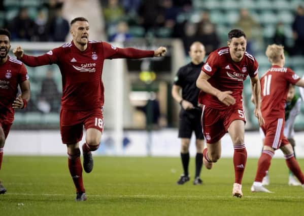 Aberdeen players celebrate their Betfred Cup quarter-final penalty shootout win over Hibs. Picture: Craig Williamson/SNS