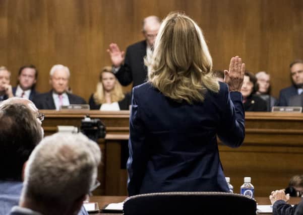 Christine Blasey Ford is sworn in at the beginning of the hearing in Washington on Thursday. Picture: Tom Williams-Pool/Getty