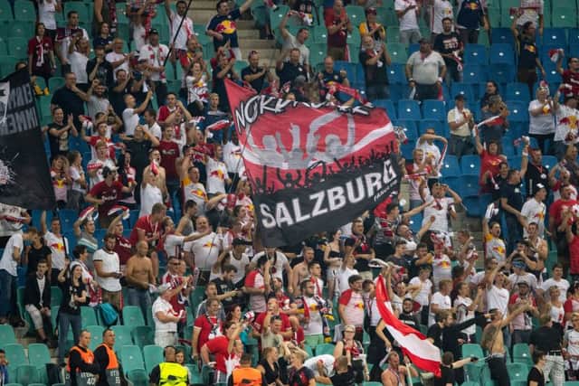 Salzburg´s fans celebrate after scoring during the UEFA Euro League. Pic: Robert Michael/AFP/Getty Images