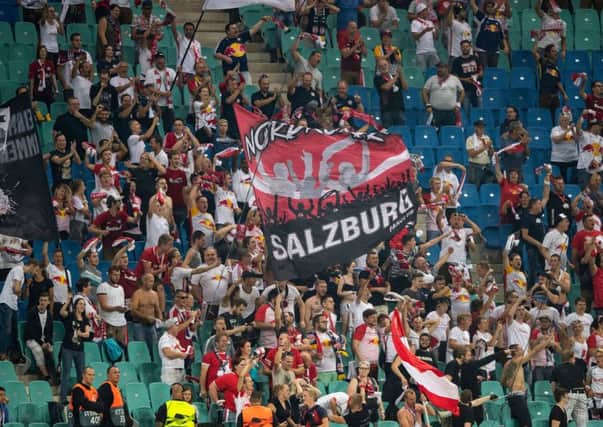 Salzburg´s fans celebrate after scoring during the UEFA Euro League. Pic: Robert Michael/AFP/Getty Images