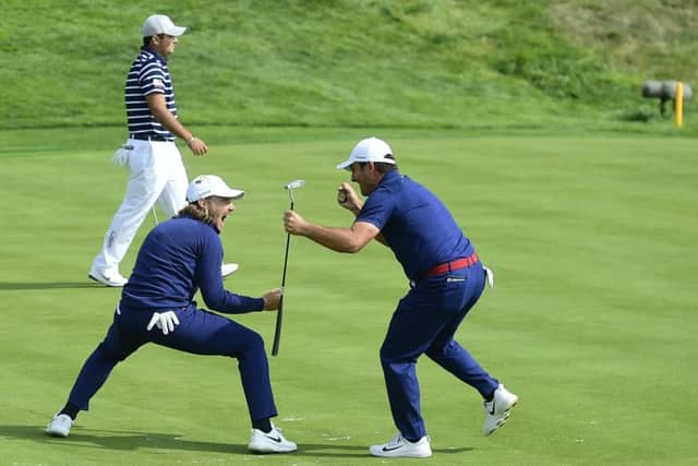 Tommy Fleetwood and Francesco Molinari celebrate on the 16th green during their crucial fourballs win over Tiger Woods and Patrick Reed. Picture: Tom Russo