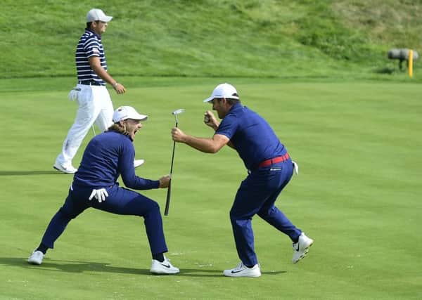 Tommy Fleetwood and Francesco Molinari celebrate on the 16th green during their crucial fourballs win over Tiger Woods and Patrick Reed. Picture: Tom Russo