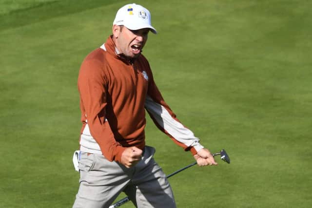 Sergio Garcia celebrates after clinching the first point on the second day of the 42nd Ryder Cup alongside Rory McIlroy. Picture: Getty Images