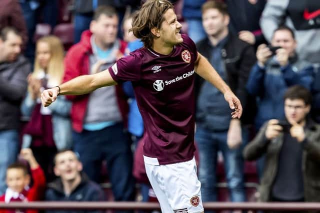 Peter Haring celebrates scoring his sides first goal. Pic: SNS/Roddy Scott
