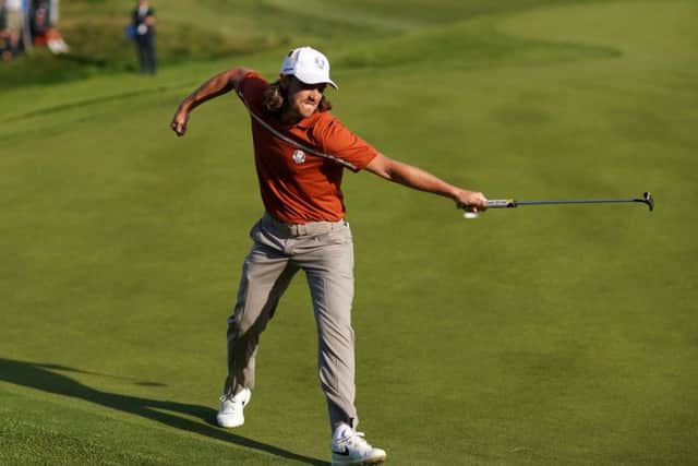 Tommy Fleetwood celebrates holing a putt to win the 12th during the afternoon foursome matches. Pic: Richard Heathcote/Getty Images