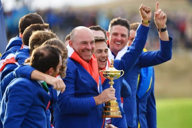 Surrounded by his triumphant European team, captain Thomas Bjorn shows off the Ryder Cup. Picture: Stuart Franklin/Getty Images