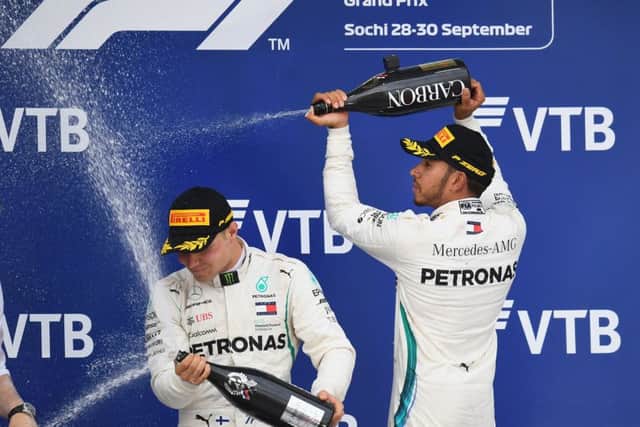 Lewis Hamilton sprays team-mate Valtteri Bottas following his controversial victory in Russia. Picture: Getty