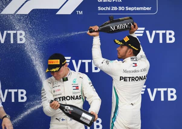 Lewis Hamilton sprays team-mate Valtteri Bottas following his controversial victory in Russia. Picture: Getty