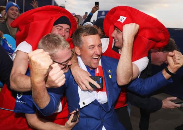 European Ryder Cup stalwart Ian Poulter  is mobbed by  his fans as the celebrations following yesterdays victory get into full swing. Picture: Getty.