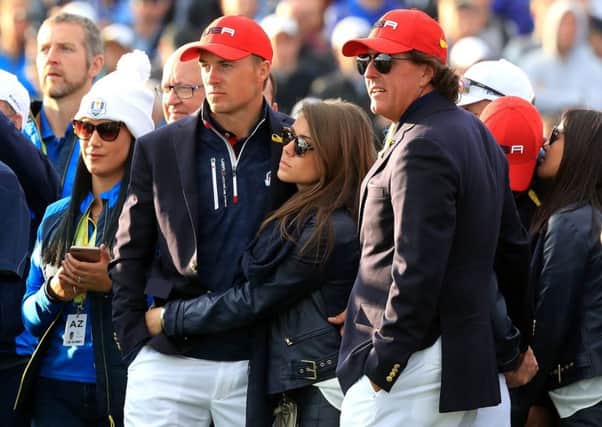 Jordan Spieth, left, and Phil Mickelson try to take in the defeat. Picture: PA.