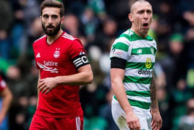 Scott Brown, right, intercepted a note sent for Graeme Shinnie during Saturday's game. Picture: SNS