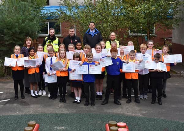 The pupils are pictured with their Junior Wardens completion certificates.