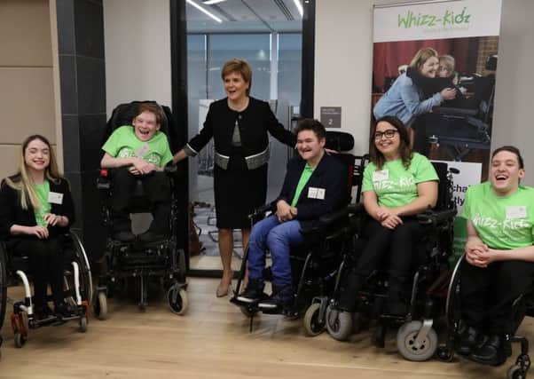 Nicola Sturgeon, the First Minister of Scotland alongside l-r Caitlyn Fulton,Joshua Millar,First Minister Nicola Sturgeon, Rian Hiney, Natalie Bell and Harry Stratton at the launch in Edinburgh of Wheeling for Change. Picture: PA
