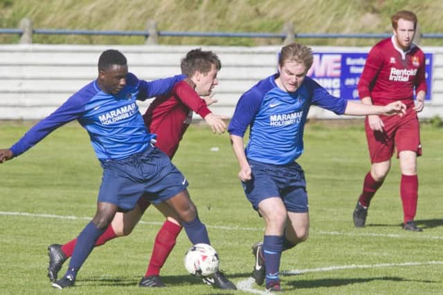 Albert's No 7 & Femi Turay dispossesses an Arniston player in a very hard fought match