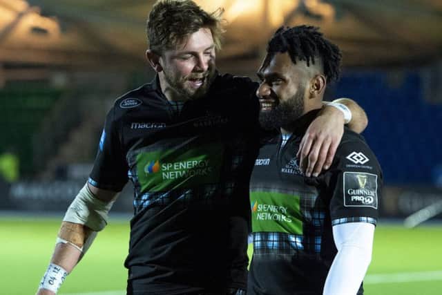 Glasgow Warriors' Ryan Wilson and Niko Matawalu leave the field after the win over Dragons. Picture: Ross Parker/SNS