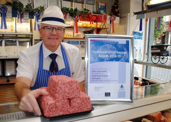 Allan Learmonth, from Learmonth's Butchers in Jedburgh, with his award-winning flat sausage.