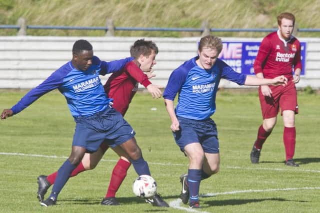 Albert's No 7  & Femi Turay dispossesses an Arniston player in a very hard fought match