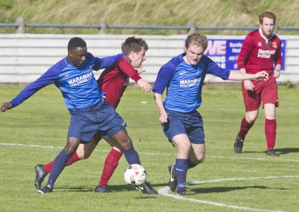 Albert's No 7  & Femi Turay dispossesses an Arniston player in a very hard fought match