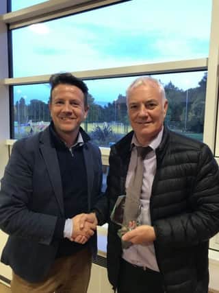 Trophy awarded by Paul Mills (Club Chairman on the left) to Willie McGinlay (on the right).