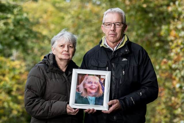 Gerald McNally and his sister Margaret Milne hold a photo of their late mum, Margaret McNally.