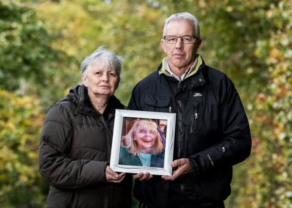 Gerald McNally and his sister Margaret Milne hold a photo of their late mum, Margaret McNally.
